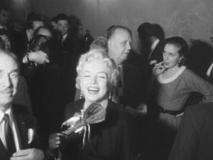 Marilyn accepts the keys to Warner Brothers, 1956. (Pat Newcomb at right)